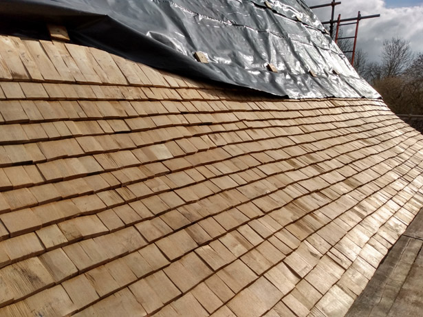 Sweet Chestnut shingles fitted to the Long House roof at Orchard Barn