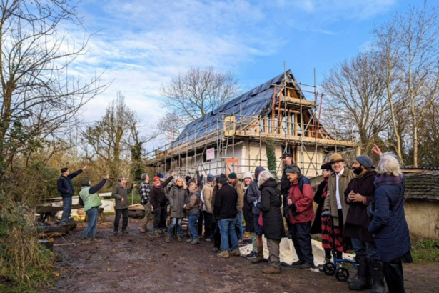 Volunteers outside the Orchard Barn Long House