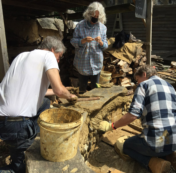 Mike, Myrtle and Jane repairing outdoor seating area